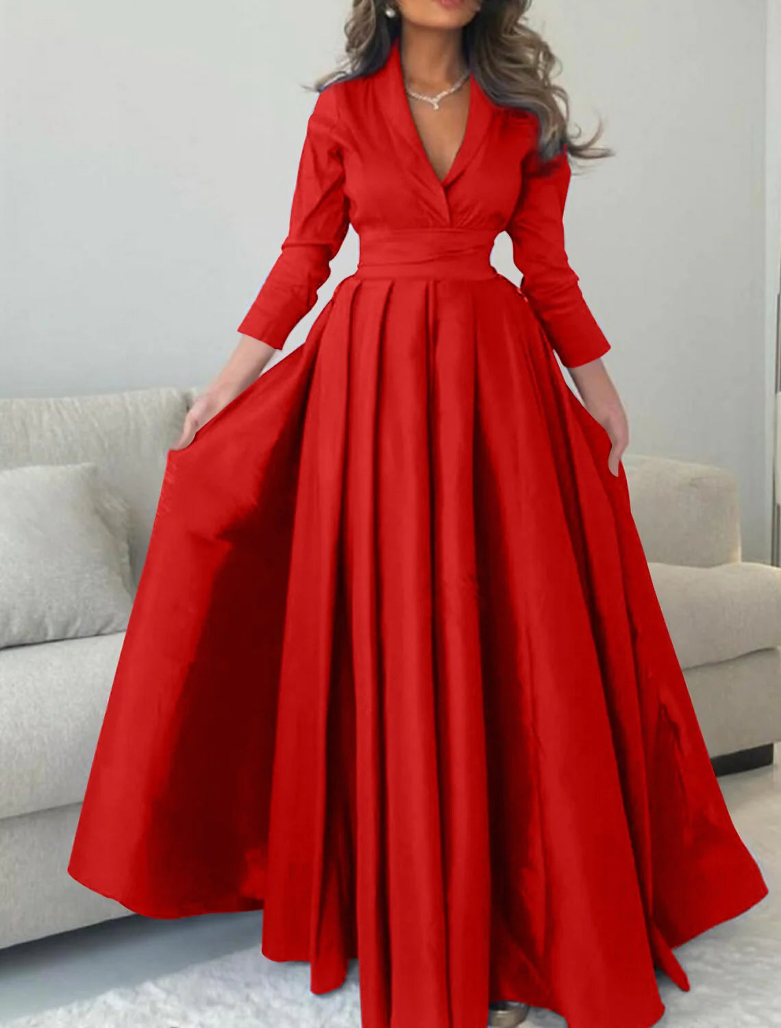 Close-up of the pleated detail on a satin evening gown.