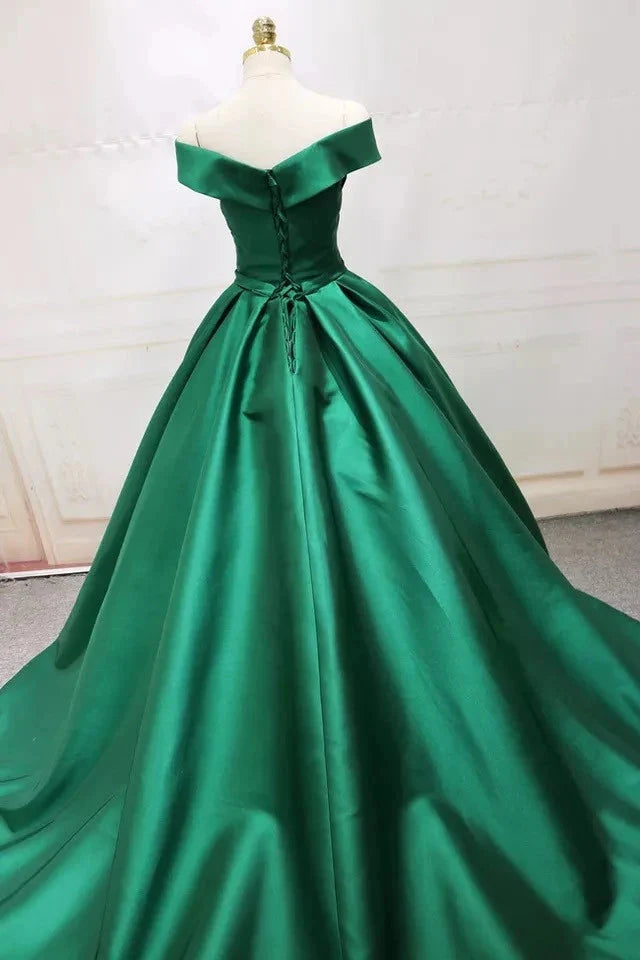Full view of green A-line satin off-shoulder prom dress.