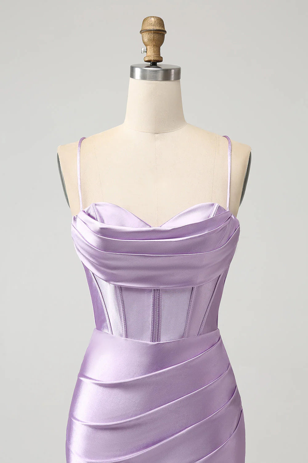 Close-up of the corset and V-neckline on a black satin dress.