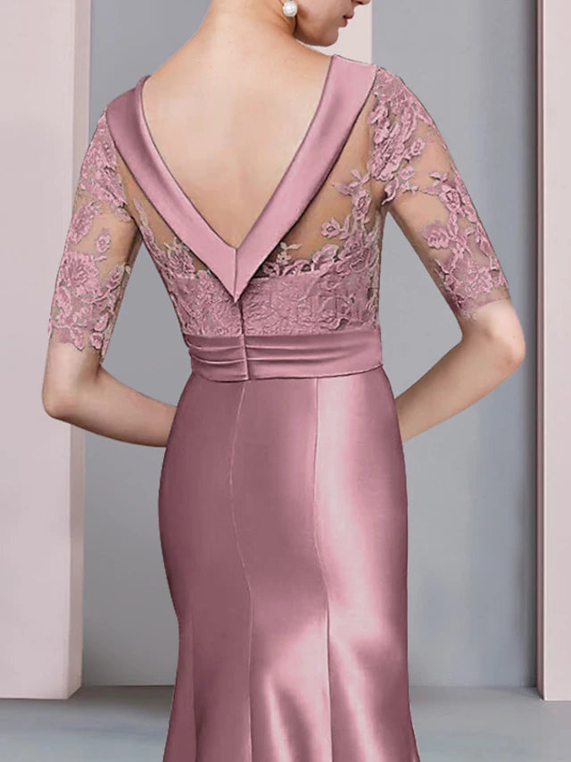 Side view of the asymmetrical Mother of the Bride dress featuring bow appliques.
