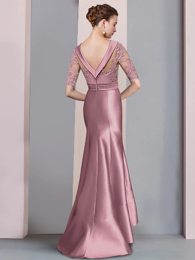 Close-up of the satin and lace details on the elegant half sleeve dress.
