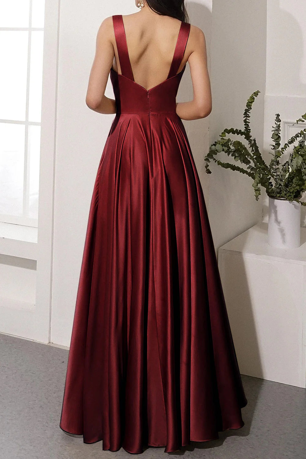Satin long formal dress with a flowing skirt and side slit.