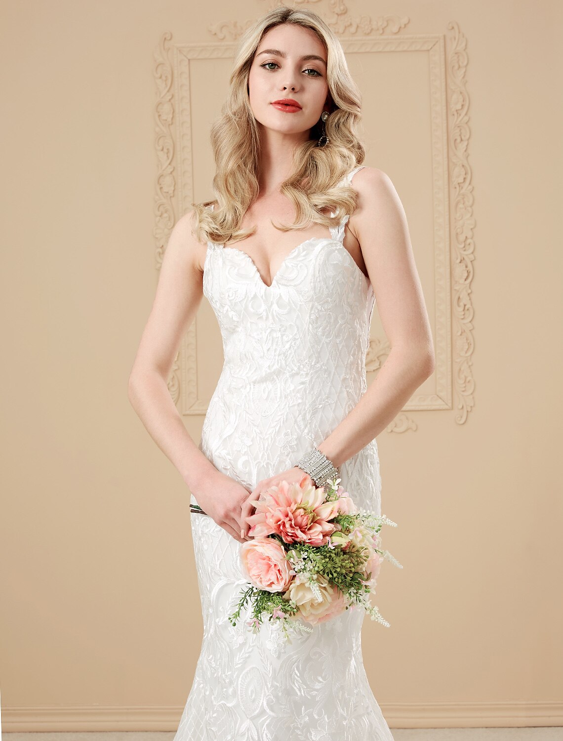 Another view of the chapel train and intricate appliques on the wedding dress.