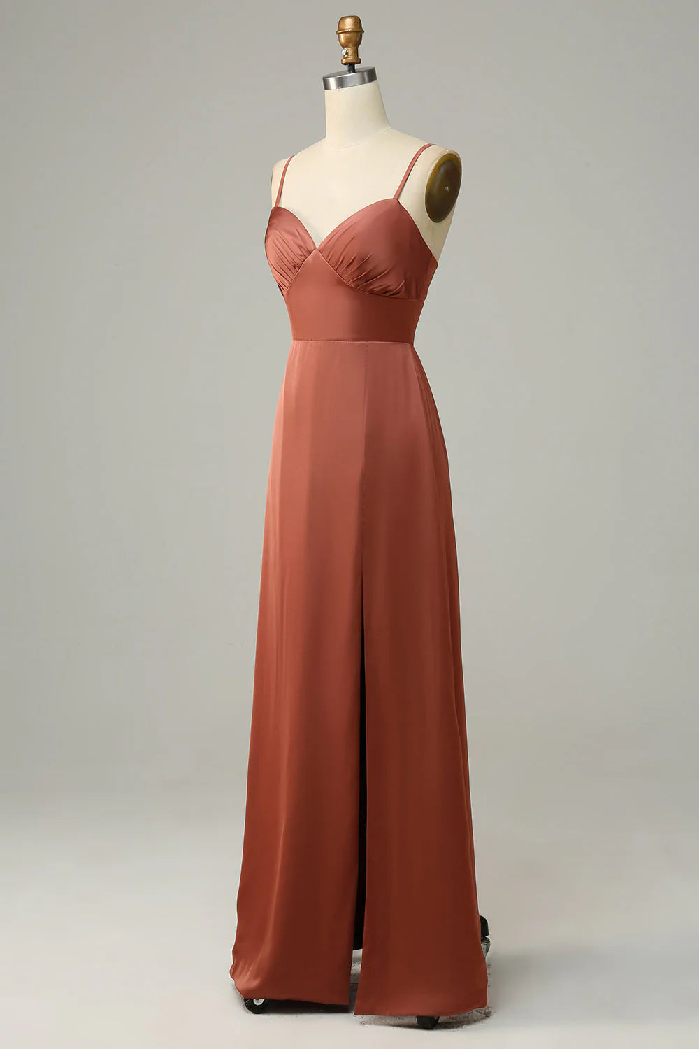 Front view of the brick red satin bridesmaid dress, showcasing the full length and stylish side slit.