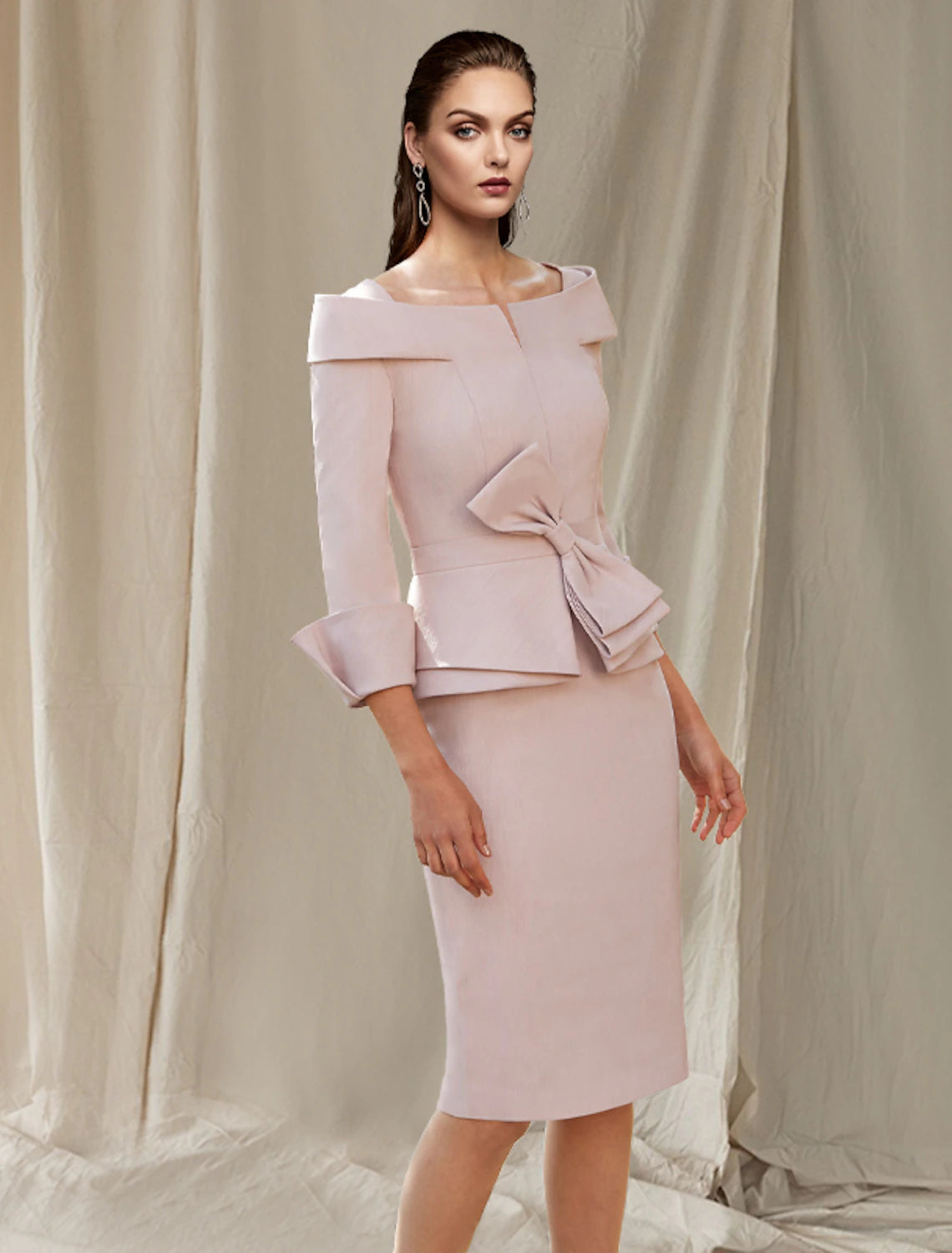 Elegant satin sheath Mother of the Bride dress with bateau neck and 3/4 sleeves.