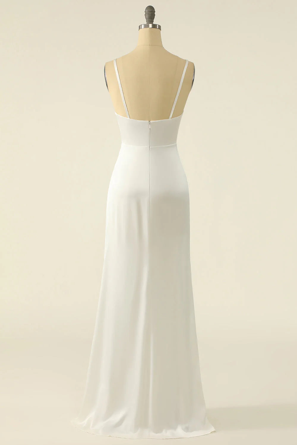 Side view of the flowing ivory satin A-line bridal gown.