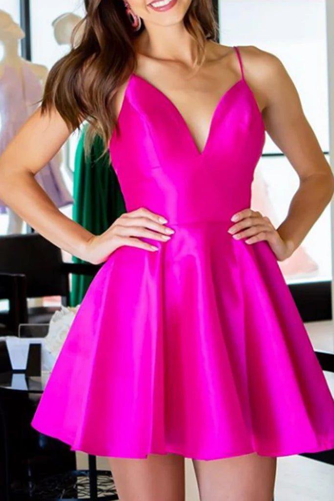 Model wearing an elegant V-neck spaghetti strap satin mini dress.