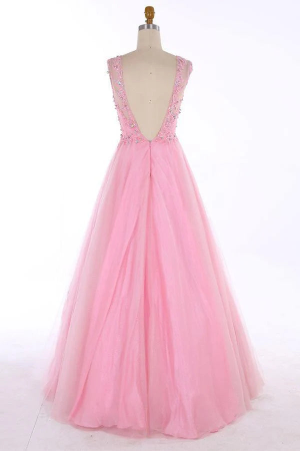 Back view of a formal gown showcasing the backless design and delicate beading.