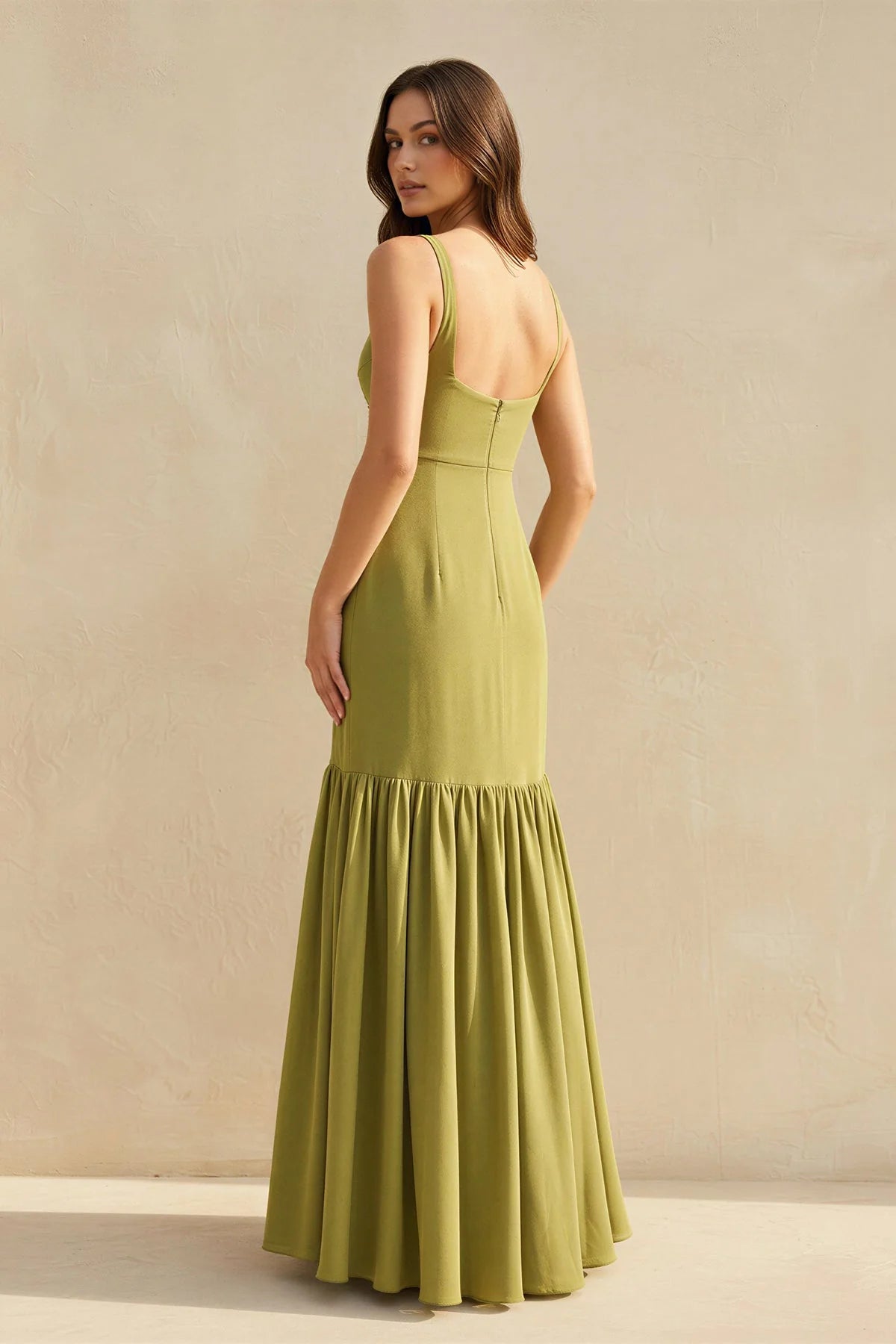 Side profile of the elegant floor-length mermaid dress.