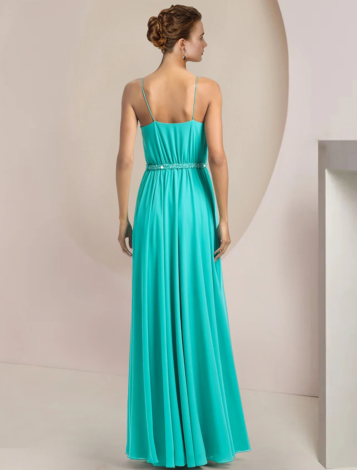 Back view of the scoop neck two-piece jumpsuit, showing the flow of the chiffon fabric.