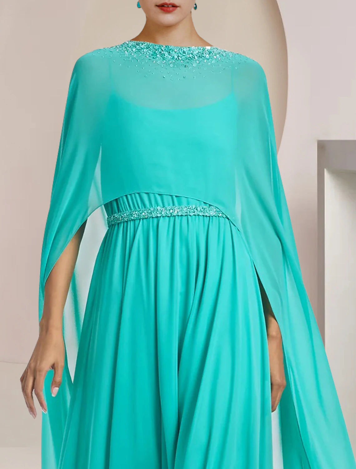 Detail of the beading and appliques on the chiffon fabric of the pantsuit.