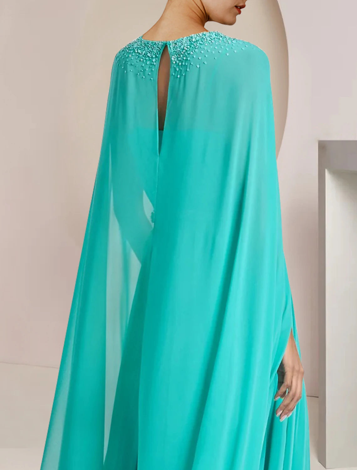 Model showcasing the movement and comfort of the two-piece formal jumpsuit.