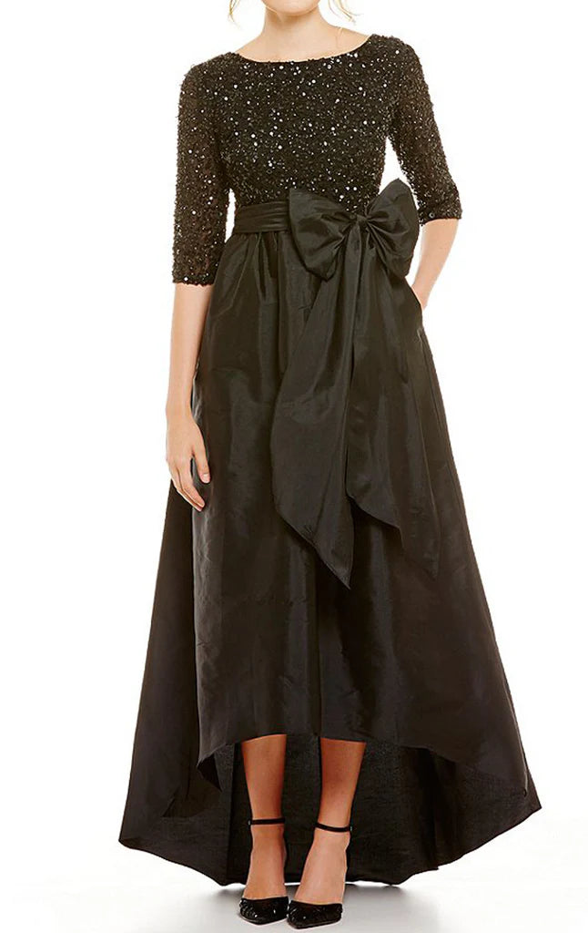 Close-up of the sequin fabric and half sleeve design of the formal Mother of the Bride dress.