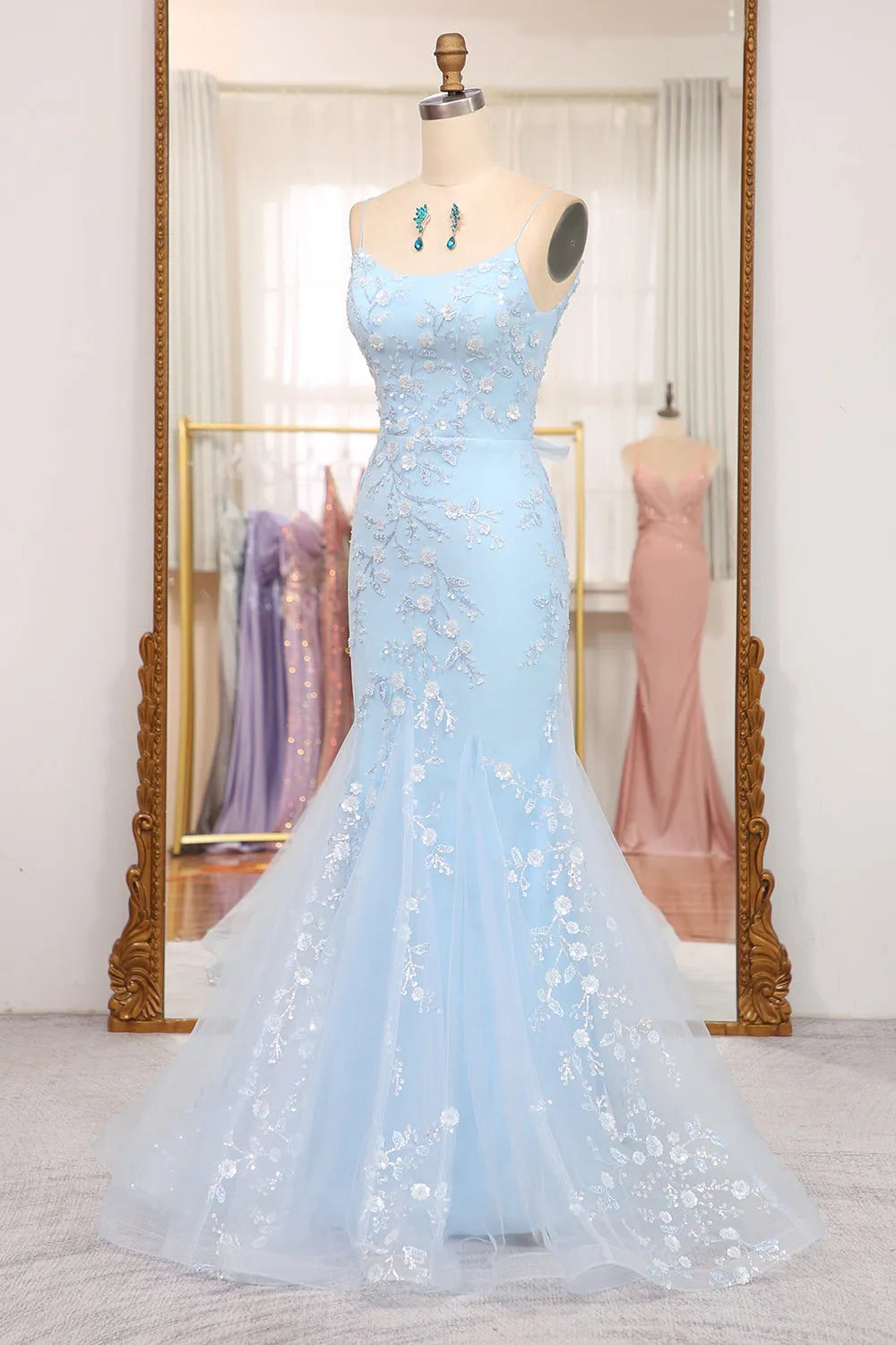 Back view of the blue sequin mermaid prom dress, highlighting the lace-up detail.