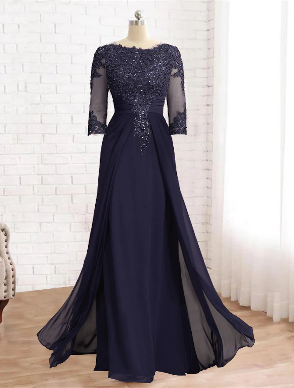 Close-up of the sequin and lace applique detail on a formal gown.