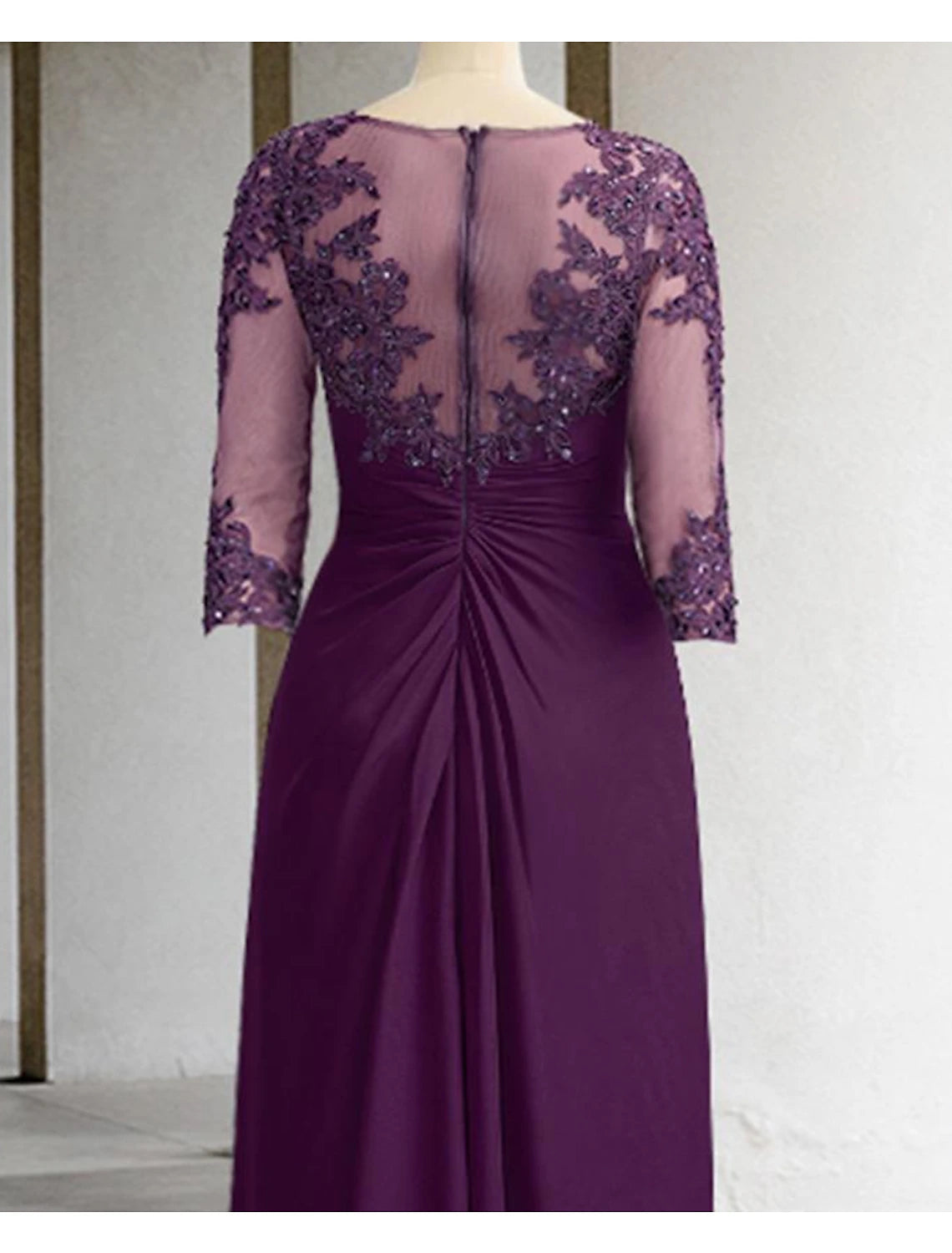 Detail of the 3/4 sleeve and scoop neckline on the sequin formal dress.