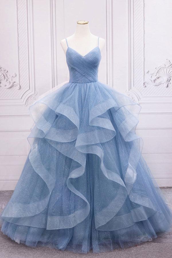 Close-up of the sequin bodice and flowing tulle skirt of a formal gown.
