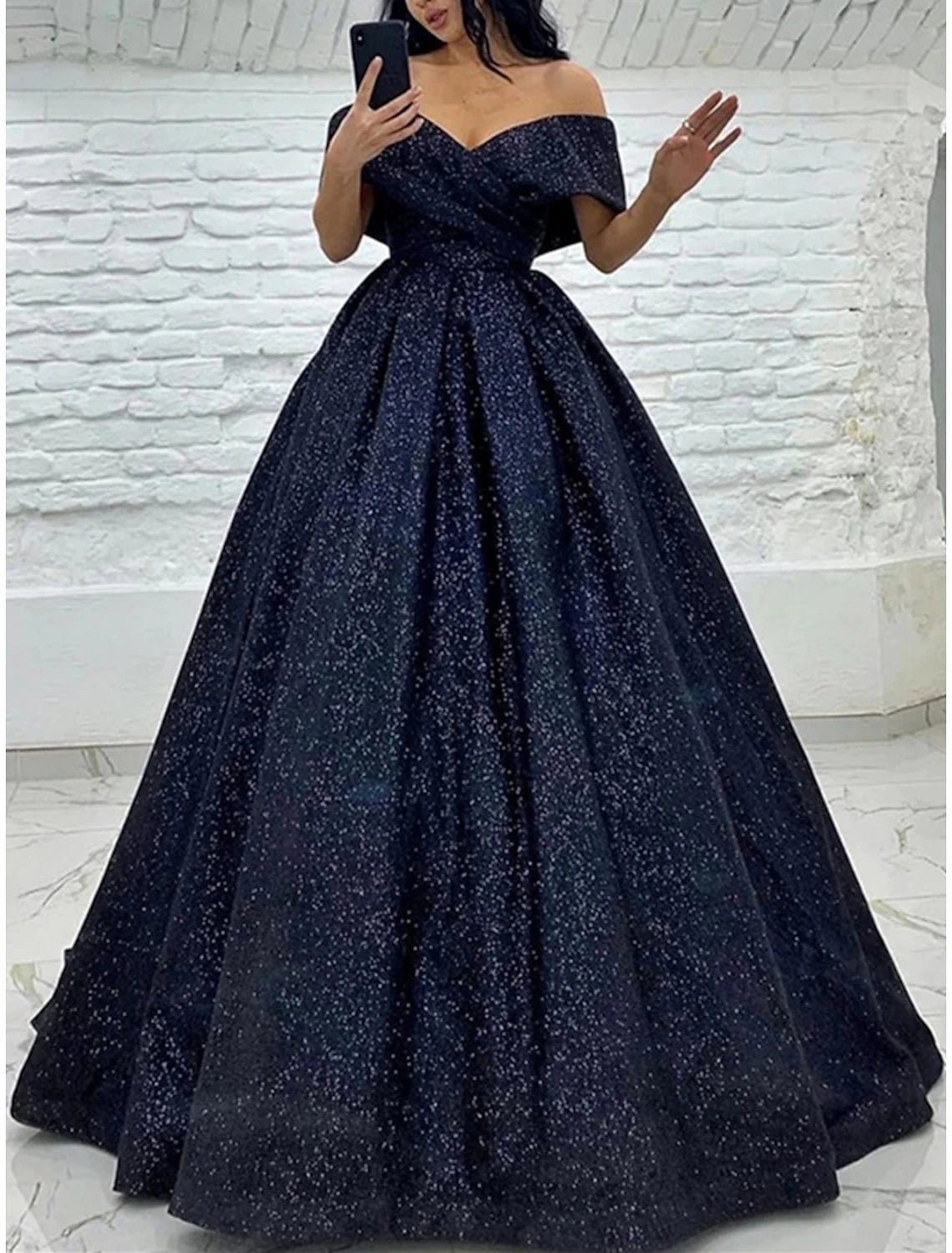 Elegant sequined A-line prom dress with off-shoulder neckline and short sleeves.