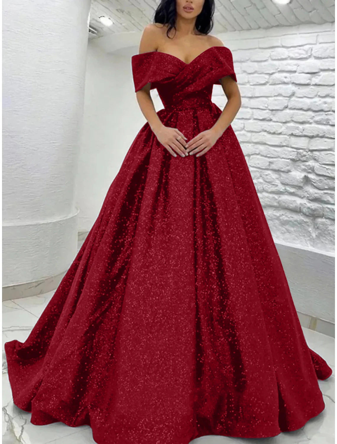 Side profile of the off-shoulder sequined A-line dress.