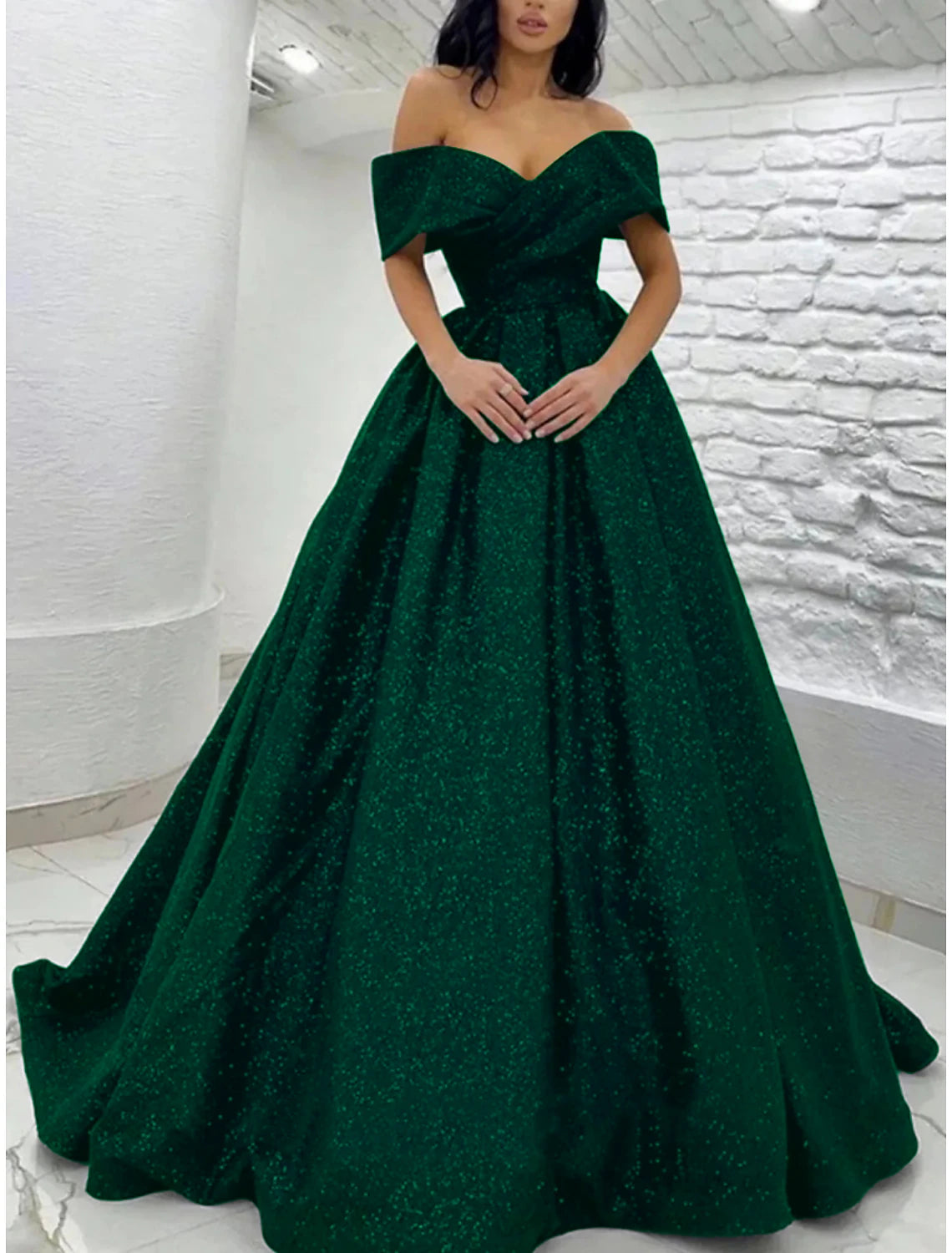 Full length view of the A-line prom dress with a flowing sweep train.