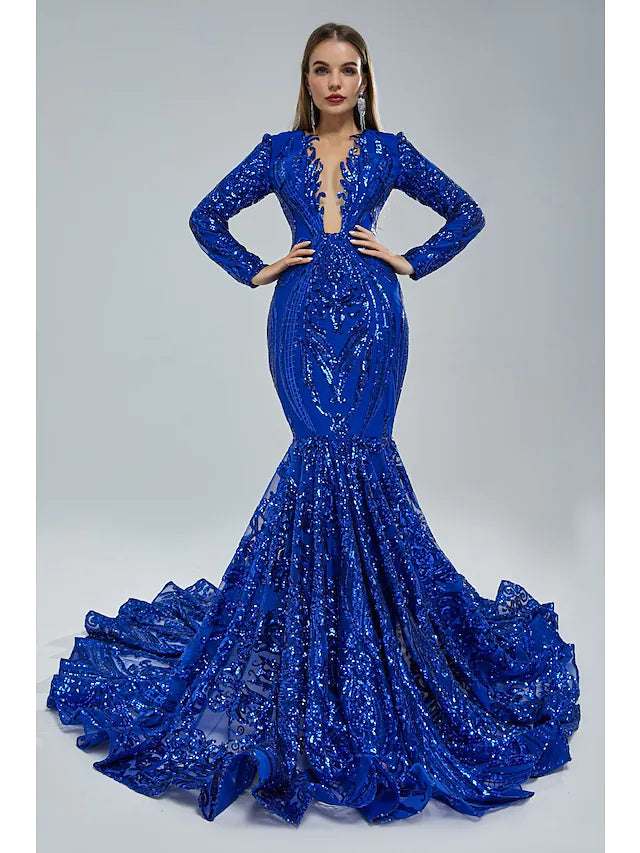 Woman wearing an elegant sequined mermaid evening gown with long sleeves and a jewel neck.