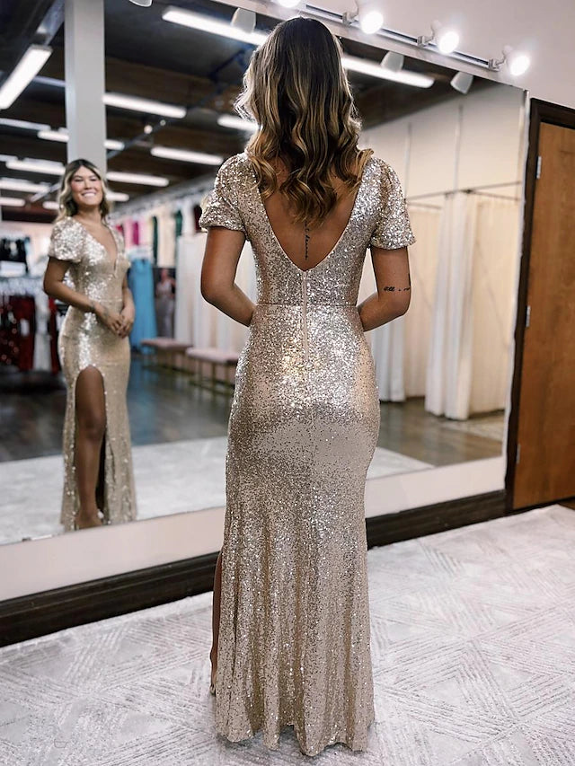 Close-up of the shimmering sequined fabric on a mermaid evening gown.