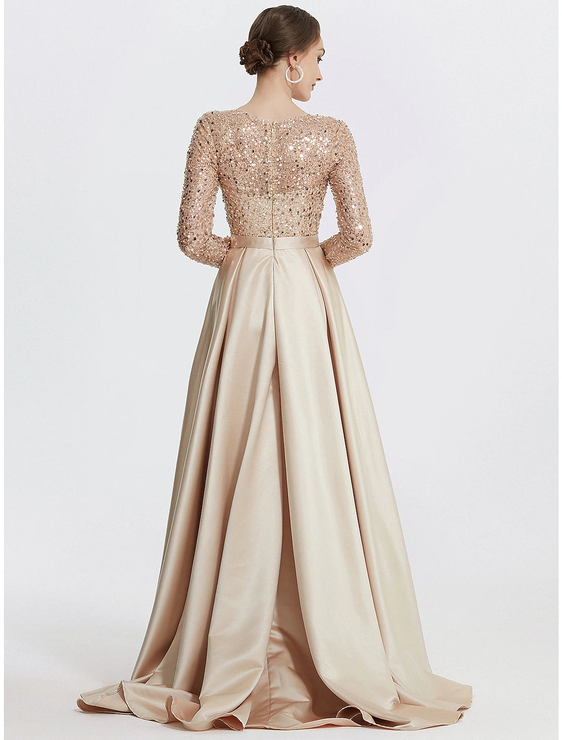 Back view of the sequined mermaid trumpet evening gown, showcasing its floor-length design.