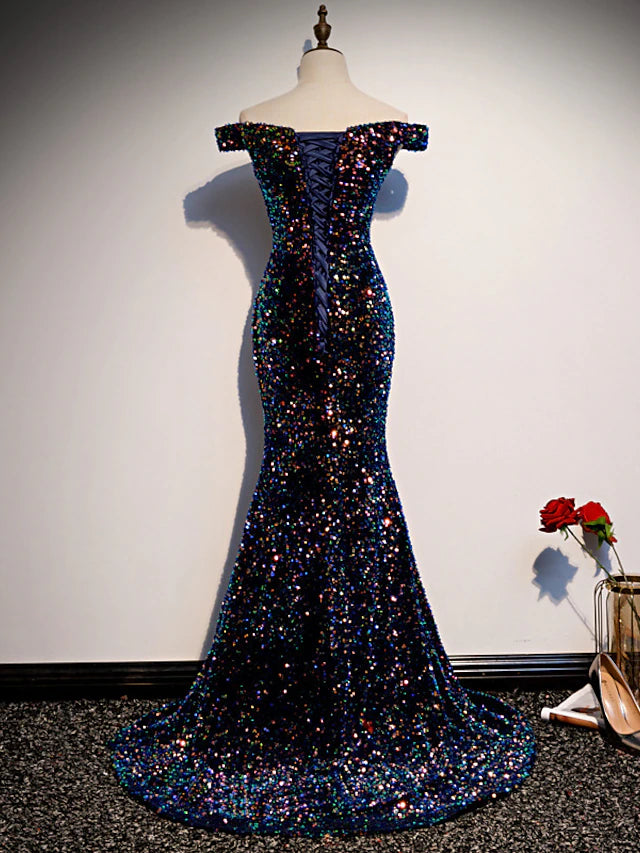 Back view of a sparkling sequined formal dress with sweep train.
