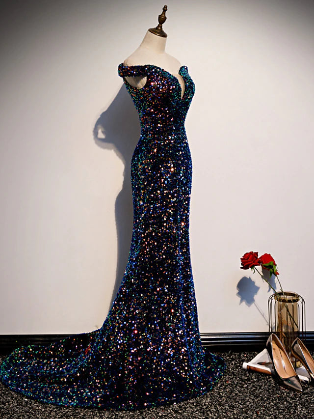 Close-up of sequin detail on an off-shoulder formal gown.