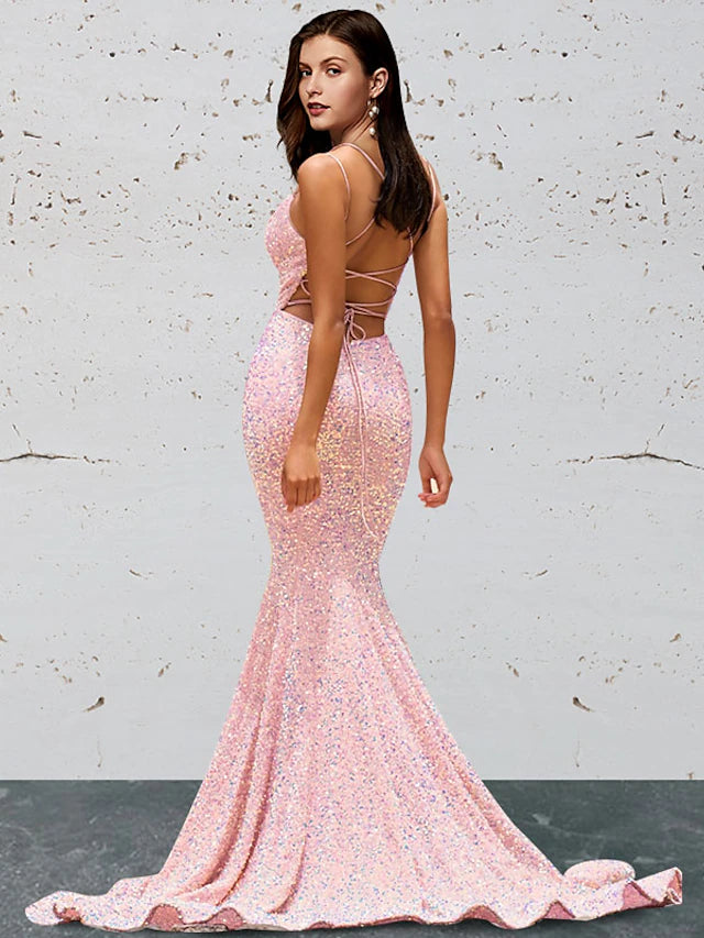 Back view of a sequined mermaid trumpet prom dress showcasing the sweep train.