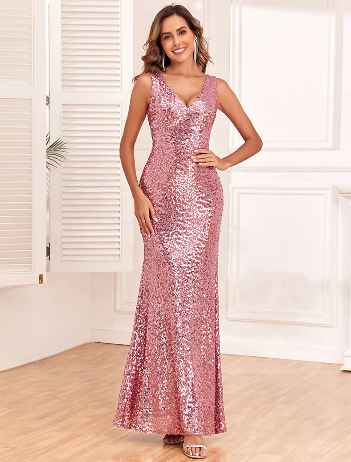 Full view of the elegant sequined mermaid gown from the front.