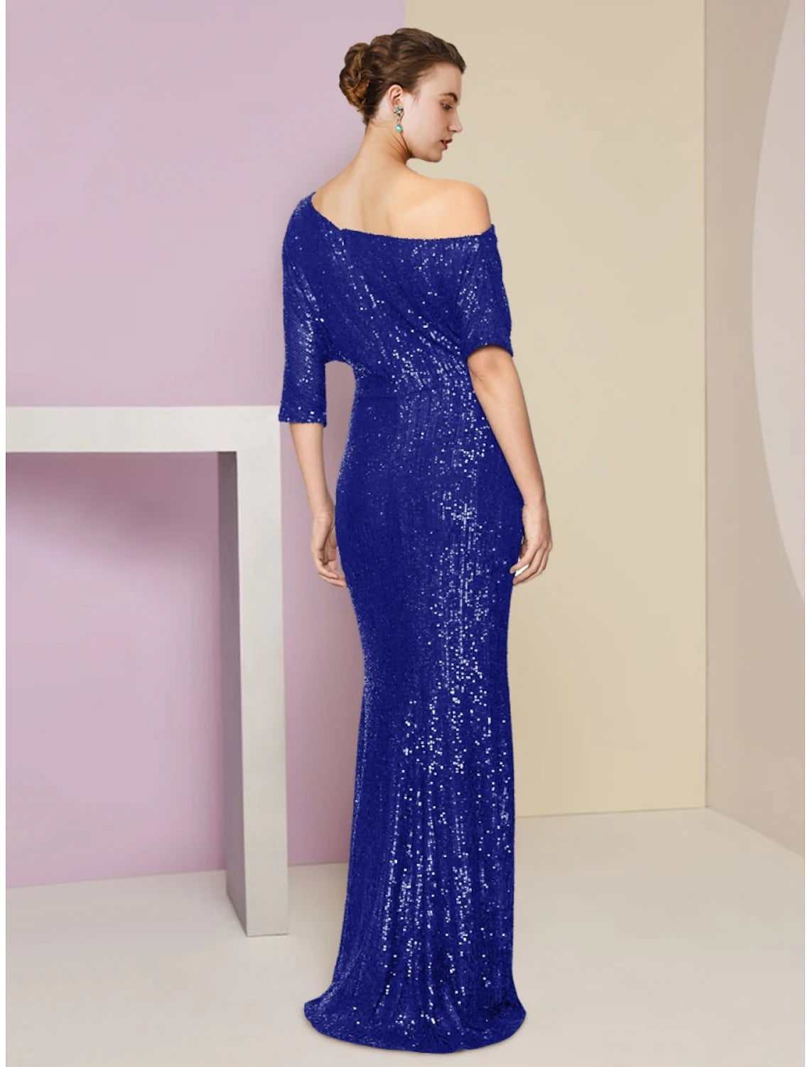 Back view of the navy blue sequined sheath dress, highlighting the elegant sweep train.
