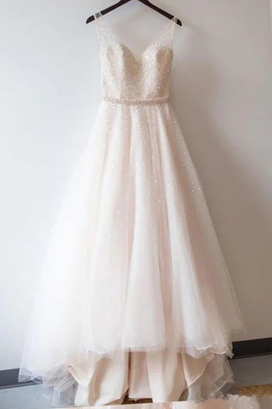 Elegant sequined V-neck maxi gown with intricate beading.