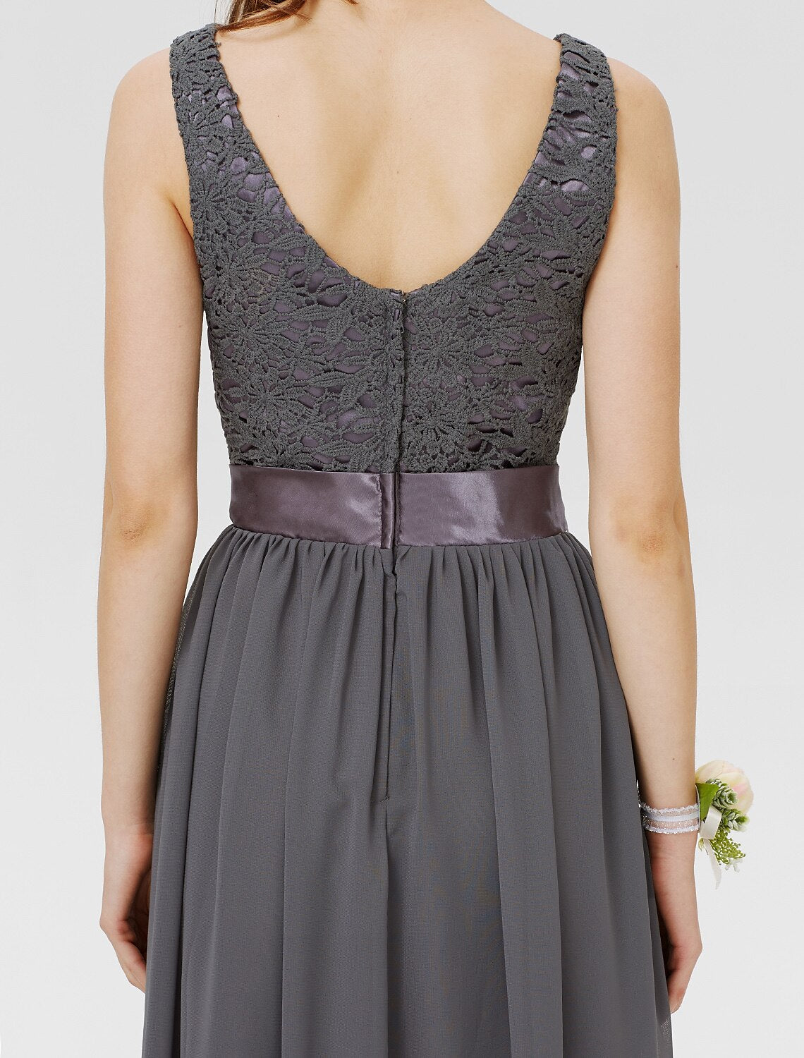 Side profile of the lace and chiffon bridesmaid gown.