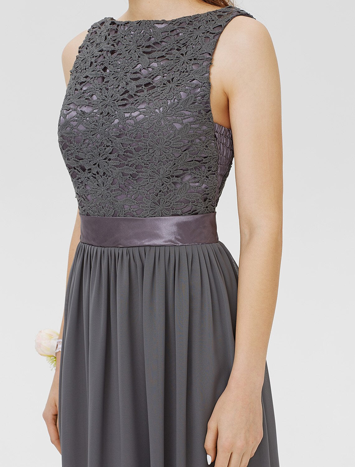 Close-up of the floral lace detail on the bridesmaid dress.