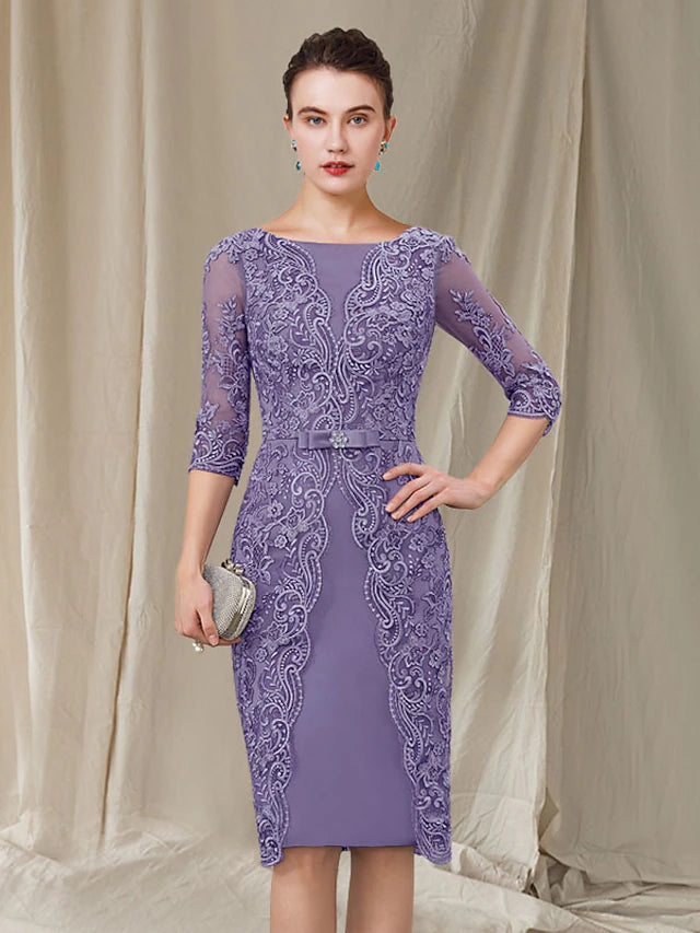 Close-up of chiffon and lace fabric with bow details on an elegant knee-length dress.
