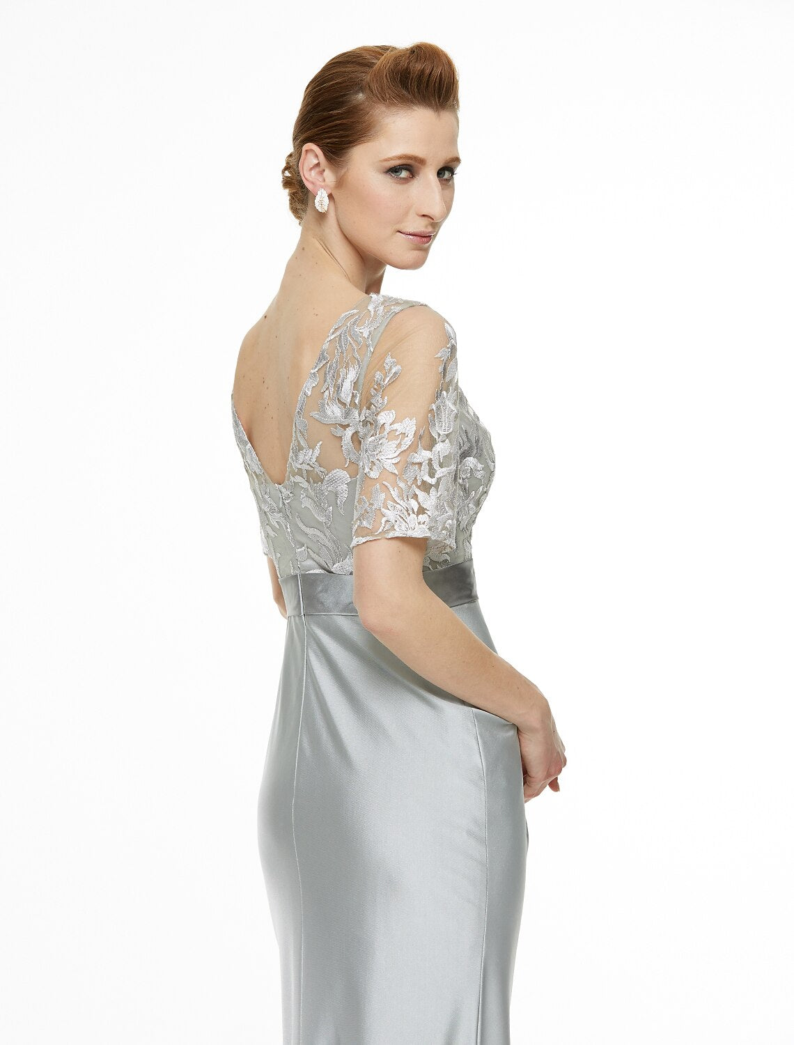 Close-up of the lace and pleat details on the mother of the bride dress.