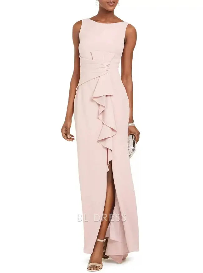 Woman wearing an elegant pleated sheath maxi dress with a bateau neckline.