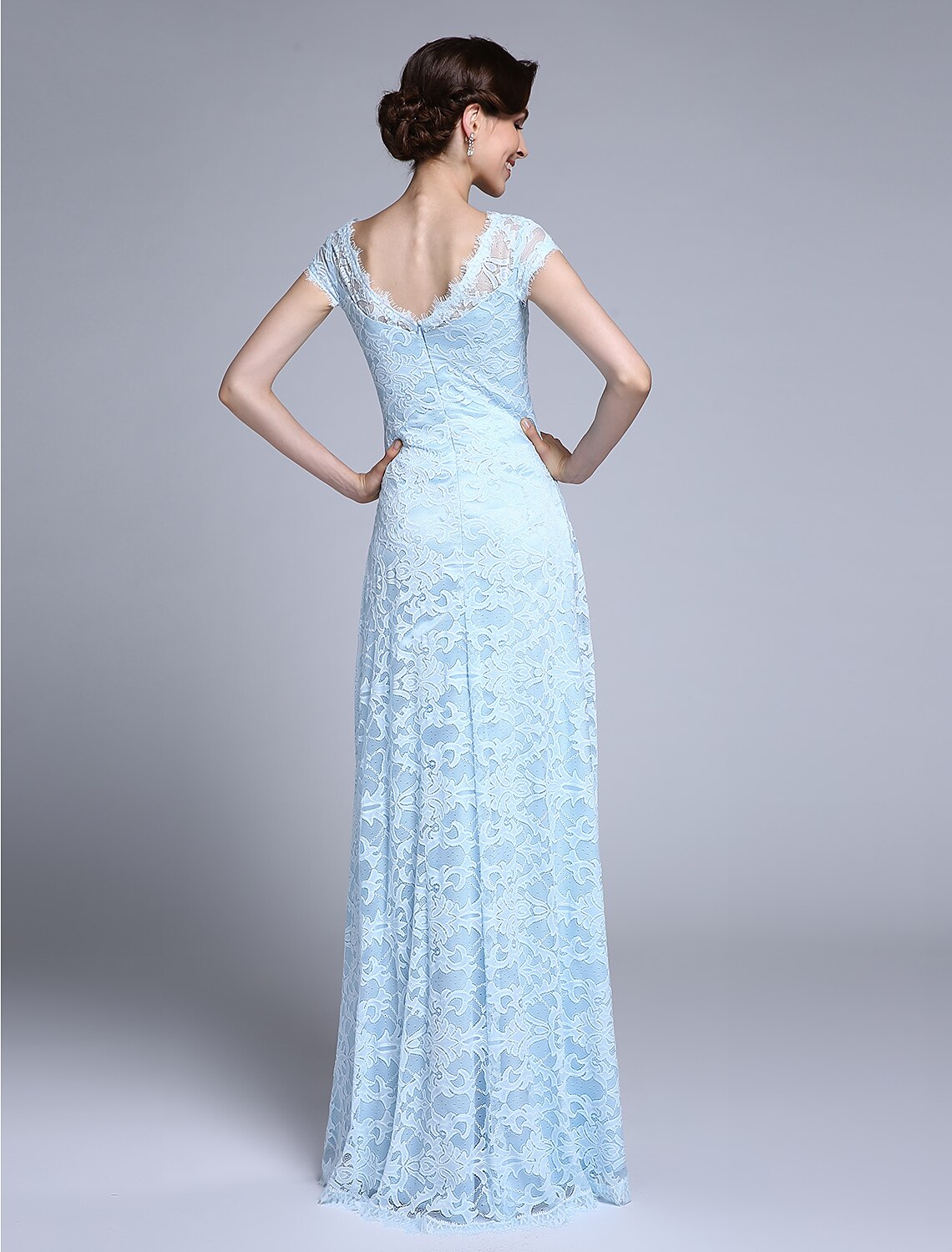Back view of the lace Mother of the Bride dress showing the open back design.