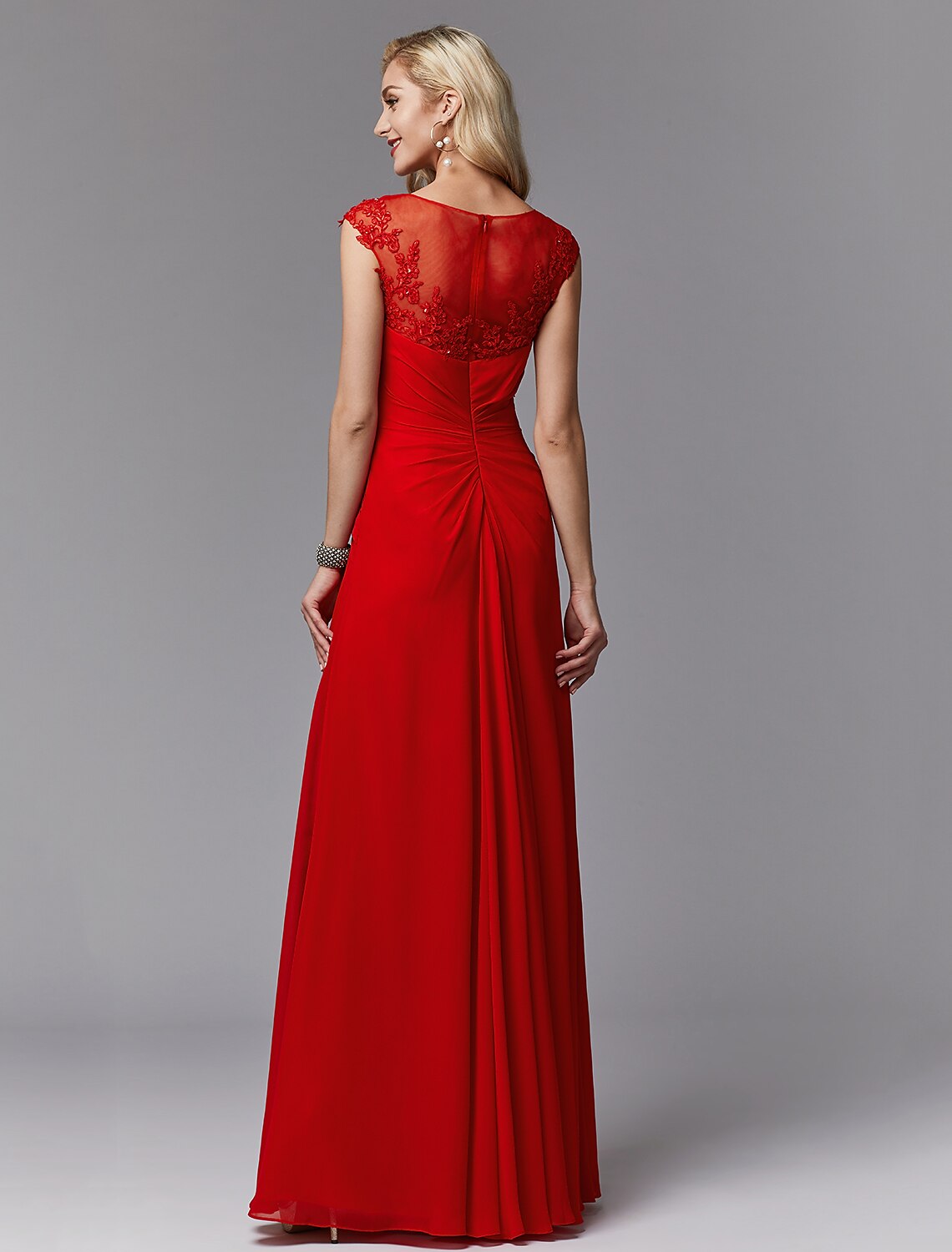 Side view of the sleeveless chiffon and lace Mother of the Bride gown.