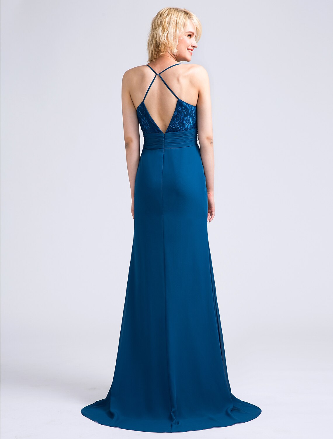 Back view of a ruched chiffon and lace bridesmaid dress with a sweep train.