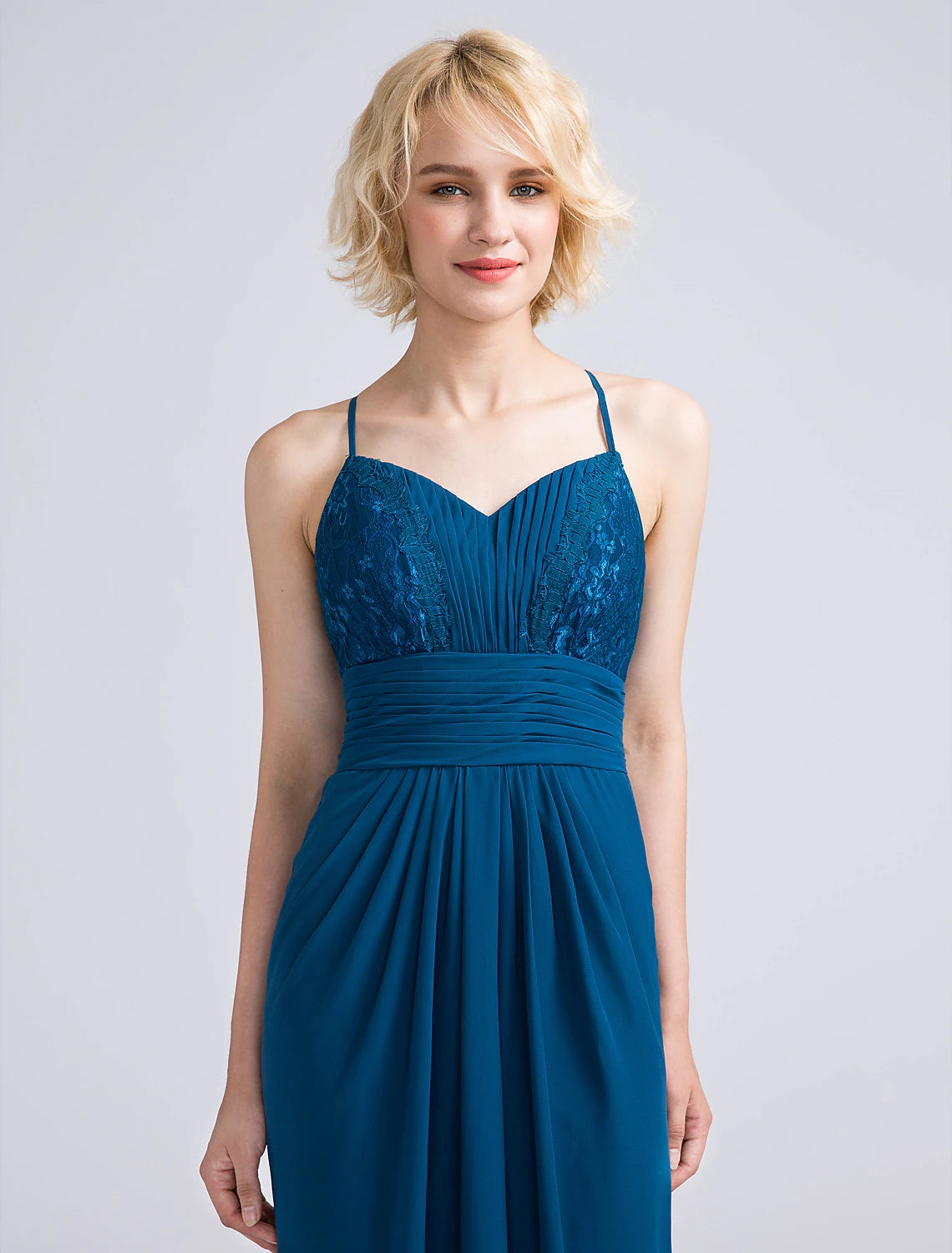 Close-up of the lace and ruched details on the bodice of the bridesmaid dress.