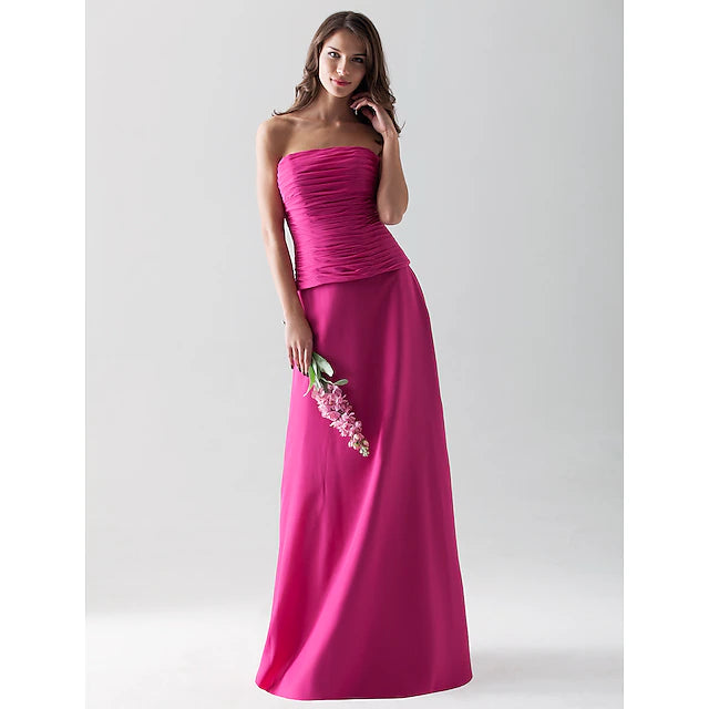Bridesmaid dress with a flowing chiffon skirt and strapless design.