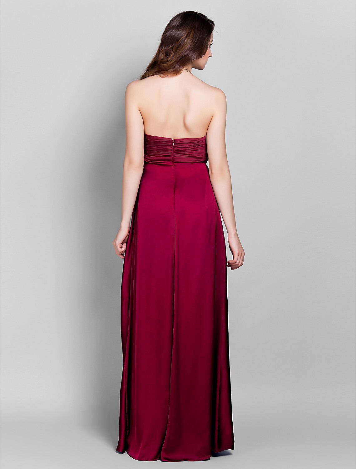 Back view of a floor-length stretch satin bridesmaid dress with open back.