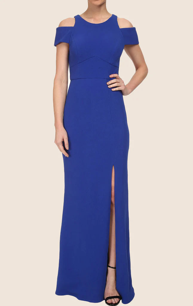 Woman wearing an elegant sheath cap sleeve formal prom gown.
