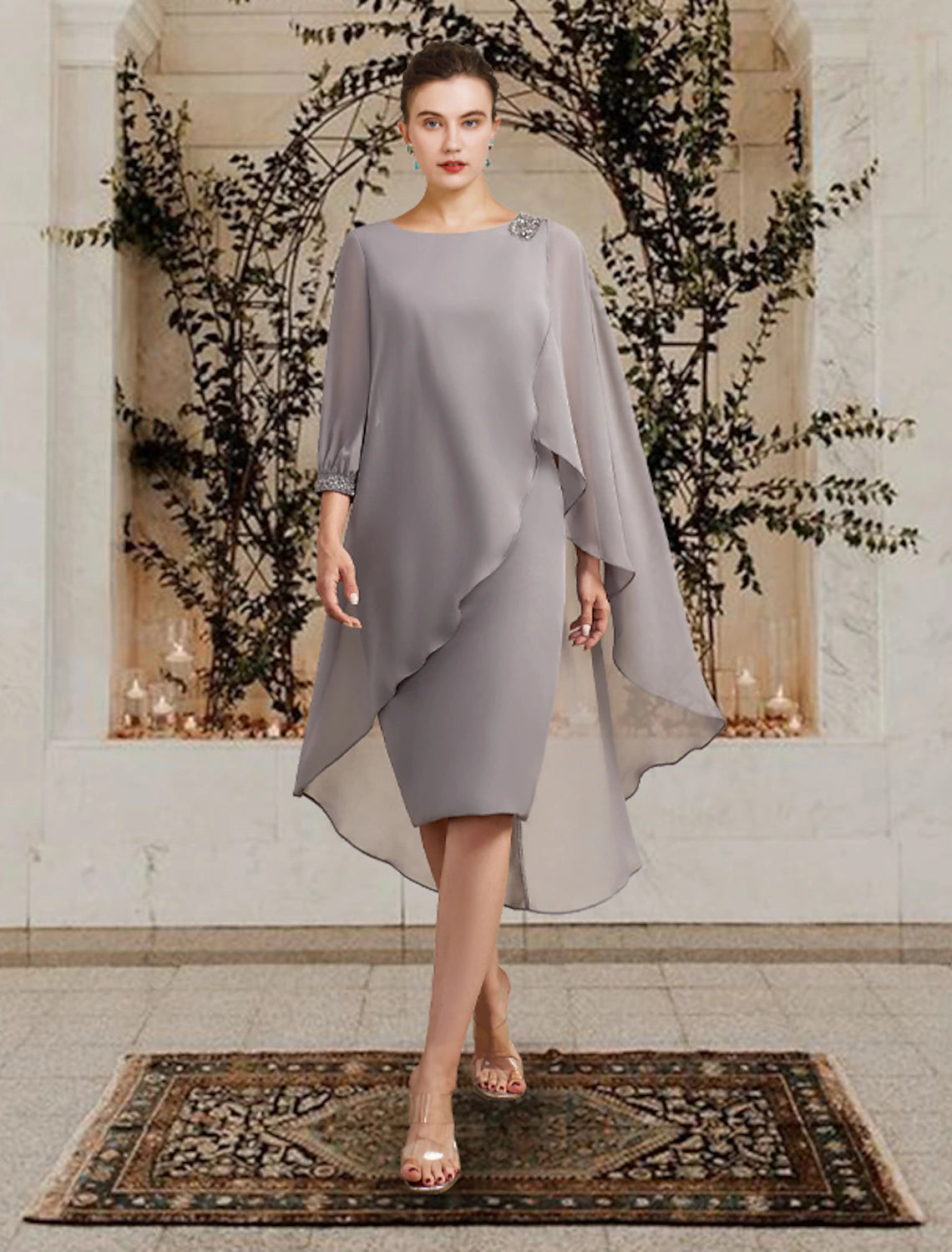 Side profile of the floor-length sheath dress, showcasing the flowing chiffon fabric.
