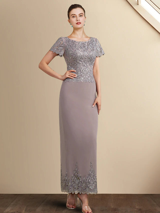 Elegant Mother of the Bride dress in a sheath silhouette with jewel neck and short sleeves.