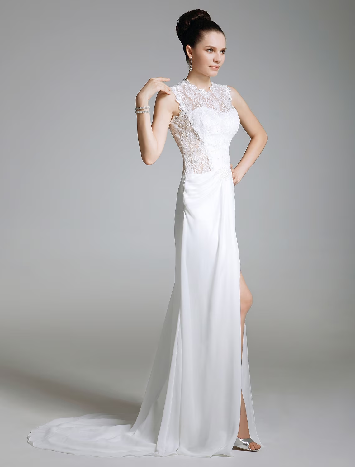 Sleeveless sheath column evening gown with illusion neck and lace split front.
