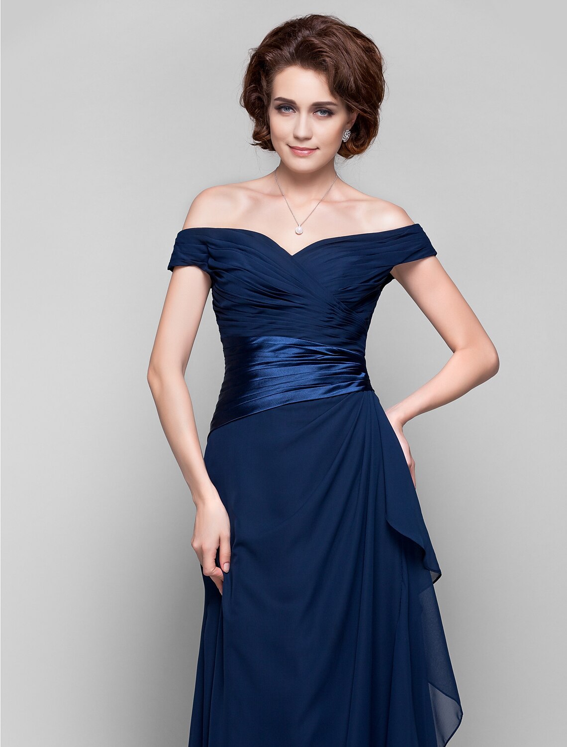 Full view of a dark blue off-shoulder sheath column dress, showing the flow of chiffon fabric.