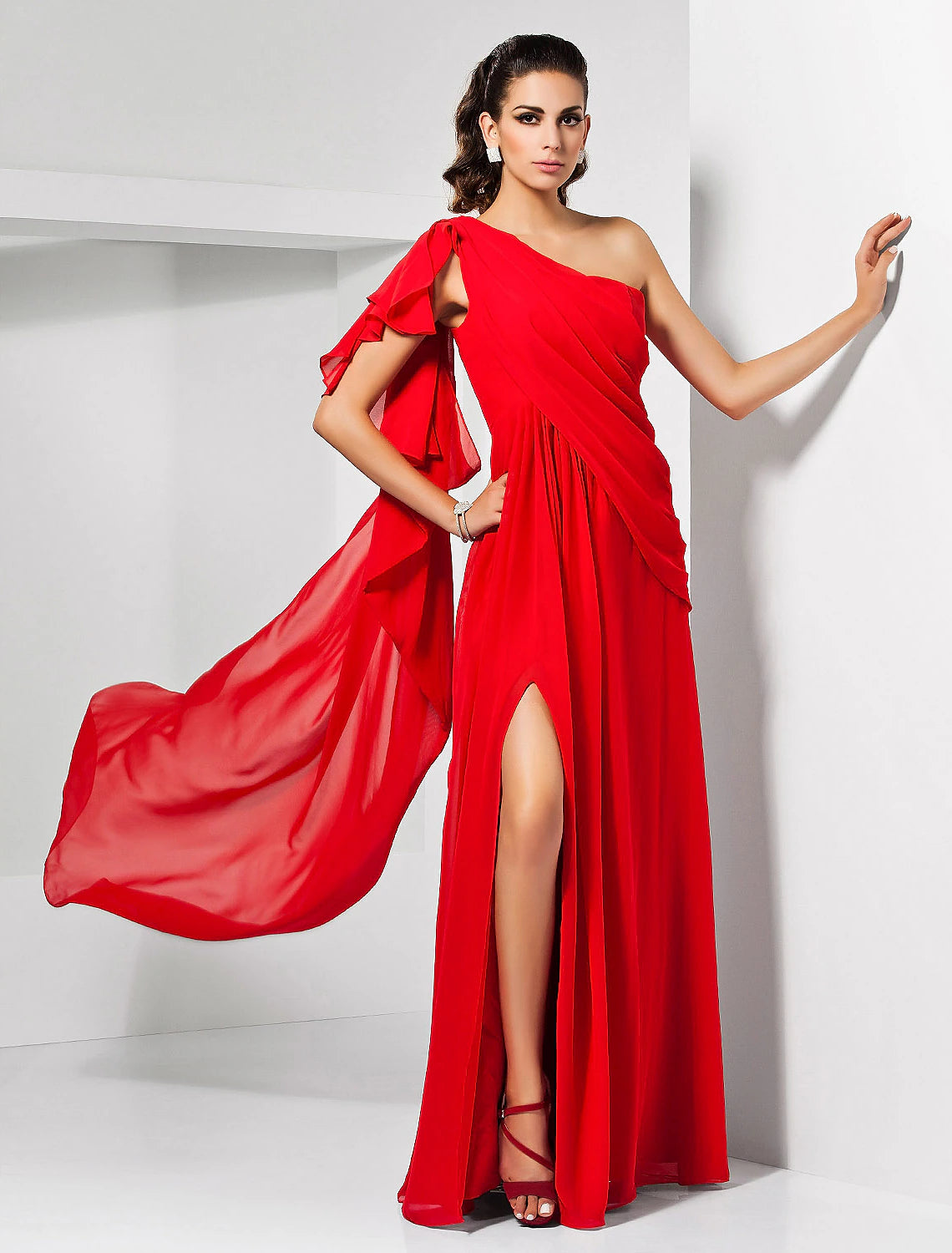 Model wearing an elegant one-shoulder blue chiffon evening dress with a draped bodice and thigh-high slit.